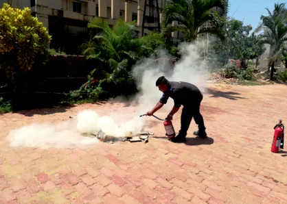 Live Demonstration putting of Fire with Fire Extinguisher part of Fire Safety Training Programs by Arya Fire and Safety to Employees and staff